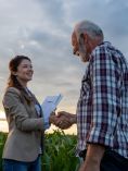 Farmer and agent shaking hands